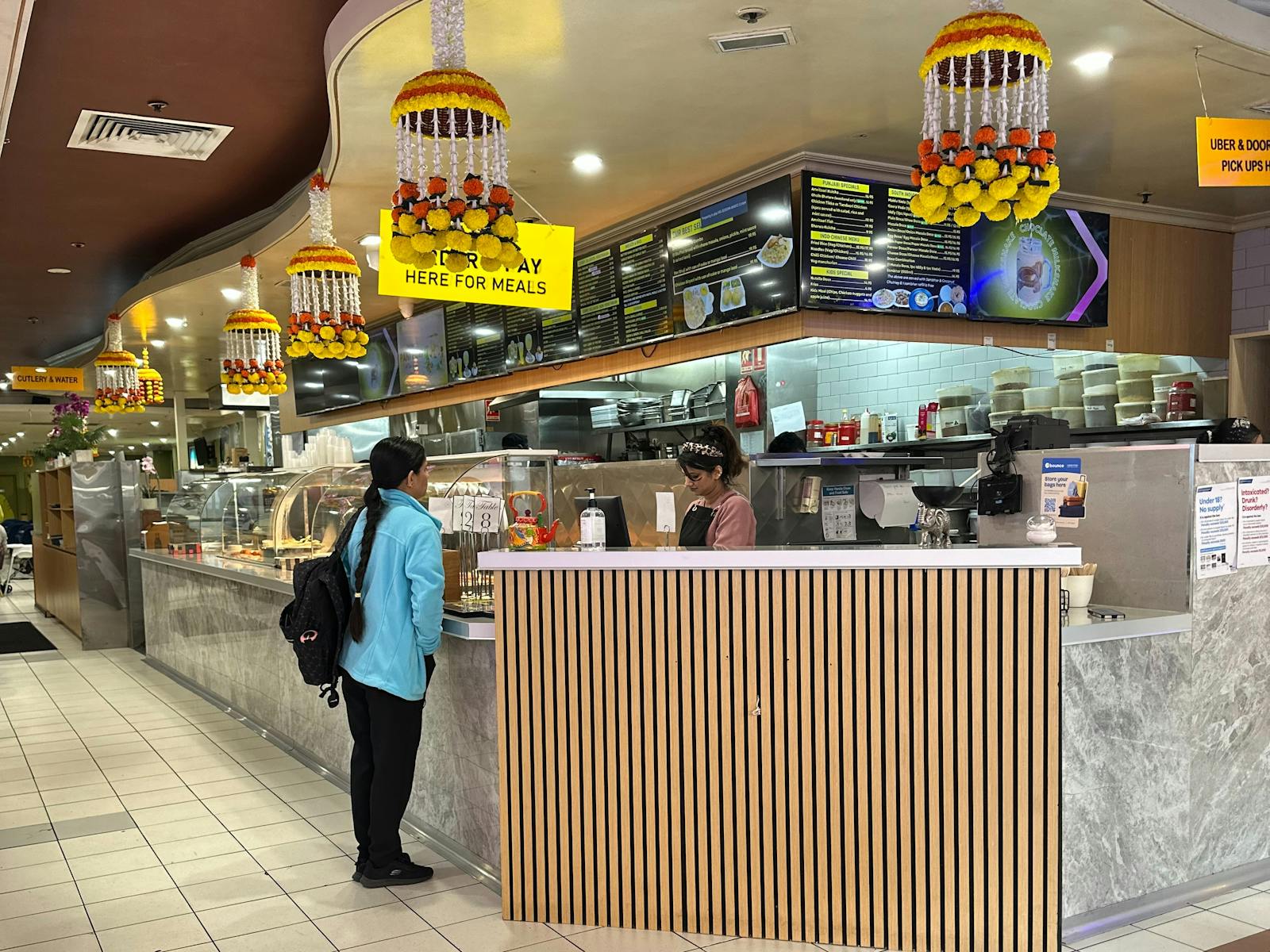 Flora Melbourne chef working with traditional Indian spices authentic craft behind AI Indian restaurant menu Melbourne