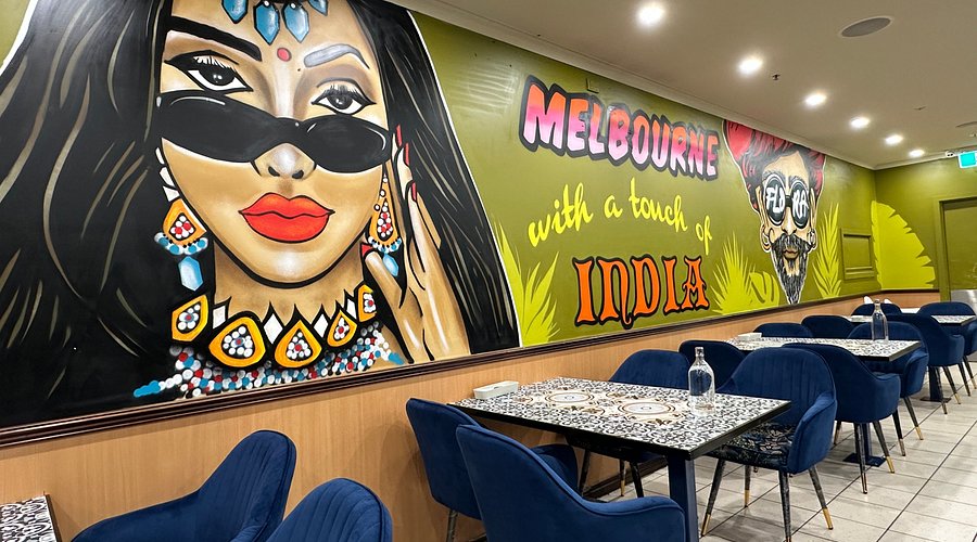 Group dining at Flora Melbourne Indian restaurant with sharing plates on table